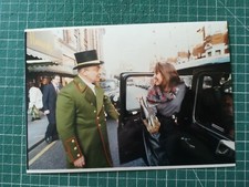 vg259 photo TBE 1999 woman getting out of an English taxi