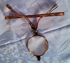 BEZEL FRAME WITH SINGLE GLASS IN THE MIDDLE, TO TIGHTEN, MADE A LITTLE MAGNIFYING GLASS