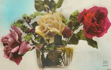 CP CLEAR VASE FILLED WITH ROSES