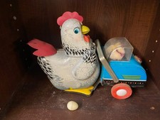 ANTIQUE CHICKEN AND HER CHICKS IN A PRAM WITH EGG CANVAS TOY