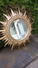 Miroir soleil mural en bois doré époque  XX siècle
