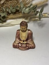 Petite statue de Bouddha rose