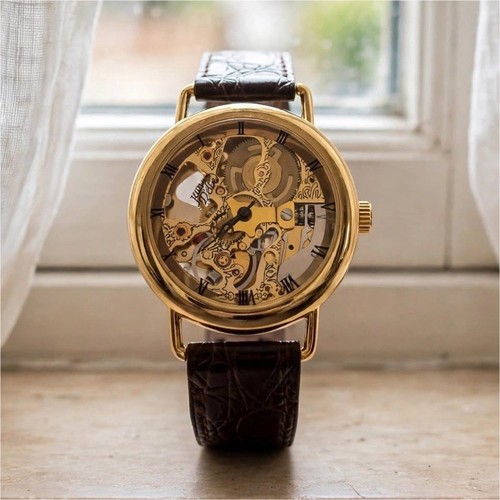 Montre squelette dorée - montre,