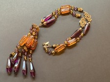 vintage collier tassle verre couleur ambre et mauve. ton or. Signé.