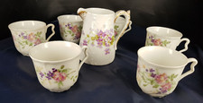 lot de 6 TASSES et un POT A LAIT en porcelaines LIMOGES FRANCE  ancien floral
