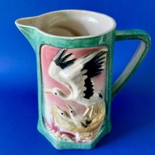 Ancien pichet Cigognes 1009 faïence St Clément France barbotine vintage oiseaux