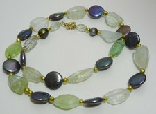 Collier perles noires, perles aigue-marine et cire dorée