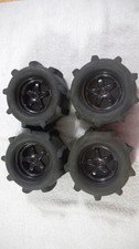 TRAXXAS T-MAXX / E-MAXX RIMS WITH PANTHER PADDLE TIRES NOT GLUDED GOOD SHAPE