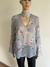 Blouse transparente fleurie à