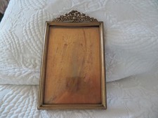 old bronze photo frame topped with a knot and flower 18 cm