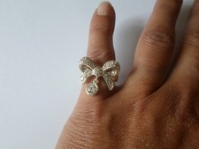 bague en argent massif, noeud et breloque, zirconiums, t. 52