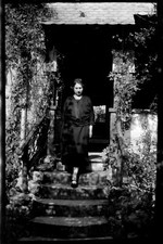 Woman descending stairs house - old negative photo year. 1920