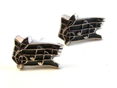 Vintage silver tone musical - silver,