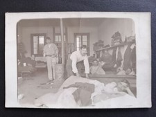Old postcard photo card SOLDIERS BARRACKS room scene of military life wood stove