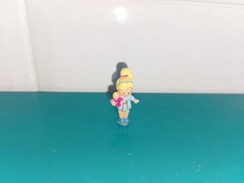 Polly pocket figurine doll