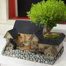 Micro-maisons sculpture pot de