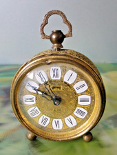 Réveil  ancien GOLDBUHL alarm boite métal doré à réparer ou pour pièces