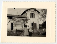 Portrait of women with children in the garden house - old photo year. 1950