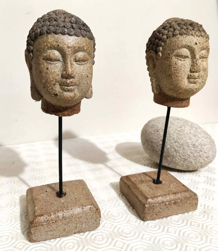 Paire têtes bouddha en - de,