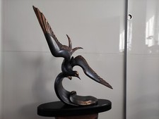 Mouette sur une vague signé