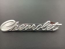 1967 Chevrolet Impala Front Grill Emblem - Script.  OEM With Mounting Bracket 