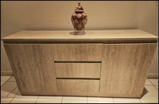 Spacious sideboard with three sliding drawers, two shelved cabinet compartments