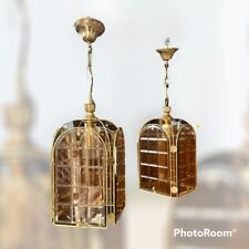 La paire de lustres vintage or et ambre années 70 Italie disponible