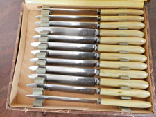 12 couteaux de table en inox