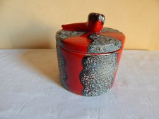 tobacco pot - wash decor on red background 