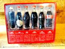 Collector de 6 mignonnettes COCA COLA - Evolution de la forme de la bouteille -