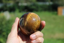 1 tiger eye sphere and wooden