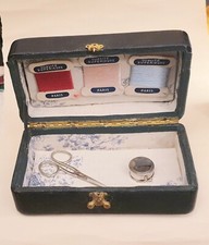 Antique suitcase shaped sewing box with accessories 