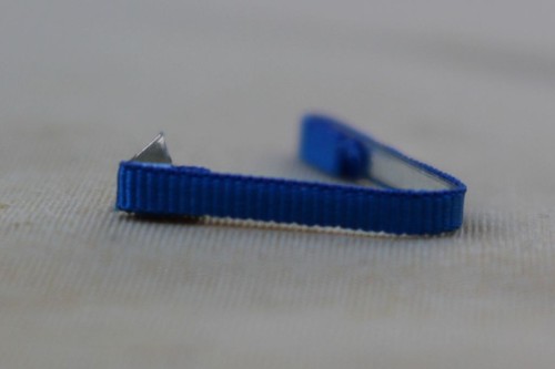 Fixe ruban rappel boutonnière