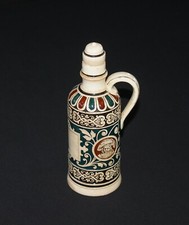 Old empty bottle distillery Garnier à Enghien in varnished sandstone