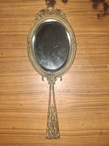 Superbe miroir face - main, en