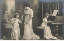 Child - Grete and Hanni Reinwald, one at the piano, the other holding the hand of a