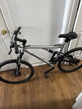 Gravity FSX 1.0 full-suspension mountain bike with Shimano EF-500 gear shifters