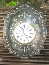 Horloge oeil de boeuf aux