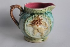 Lion Onnaing Slipper Pitcher