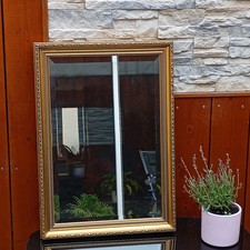 Miroir ancien avec verre biseauté – cadre doré orné