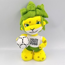 Peluche lion jaune vert South