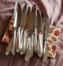 12 couteaux métal argenté