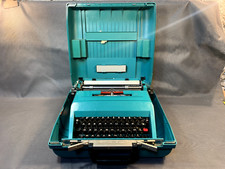 Ancienne machine à écrire OLIVETTI studio 45 vintage et sa valise en plastique