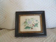 flower watercolor in its blackened wooden frame and gilded border