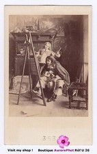 PEINTRE & ENFANT DEVANT UN