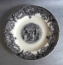 Assiette parlante en faïence de Longwy Rocaille "Le monde renversé"