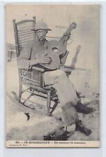 La Guadeloupe - A music lover - Guitarist in a rocking chair -