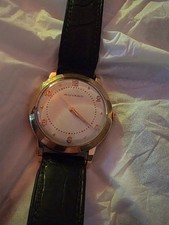 Montre movado en or 18 carats