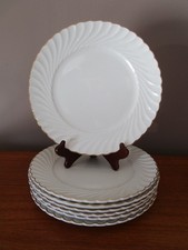 7 Assiettes plates faïence