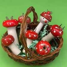 ANTIQUE TOY - WICKER DOLL BASKET TOPPED WITH 7 WOODEN MUSHROOM KNITS